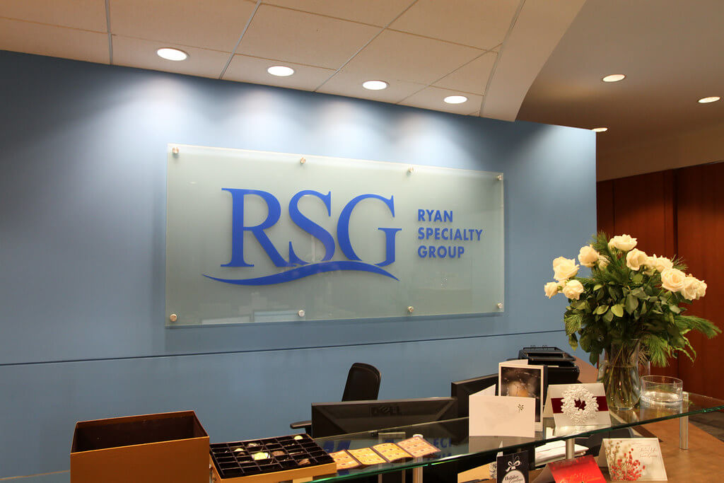 Etched glass lobby sign for Ryan Specialty Group’s corporate office