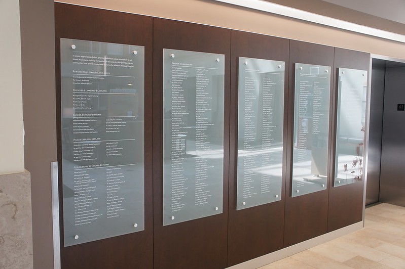 Donor wall featuring glass panels