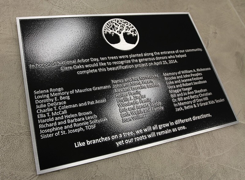 Memorial plaque in a community space, commemorating Arbor Day 