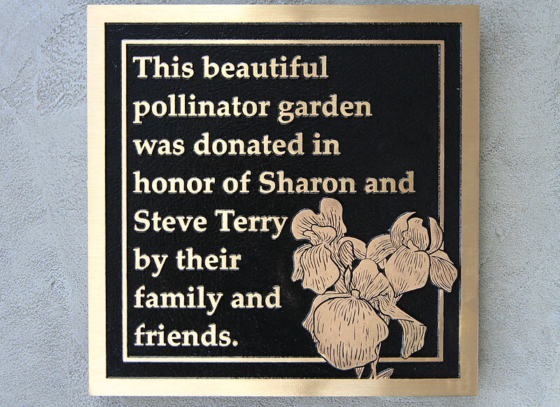 Installing a personal memorial plaque dedicated to your loved ones in a garden