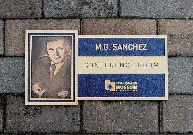 Dedication plaque placed at the entrance of a museum