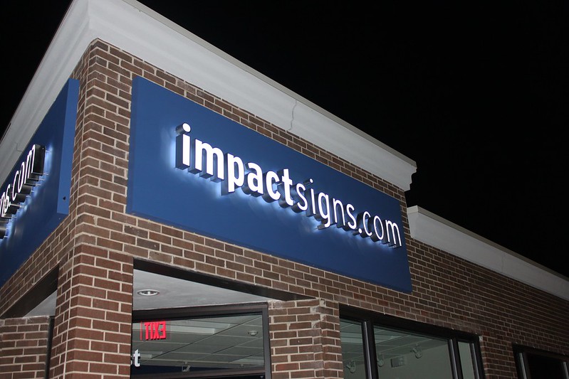 Impact Signs’ logo created with reverse channel letters 