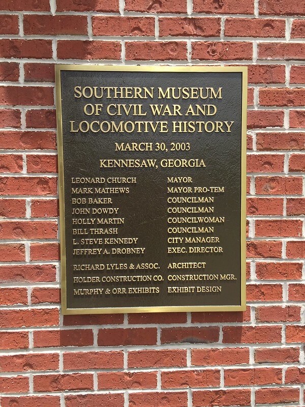 Acknowledgement plaque at a museum entryway 