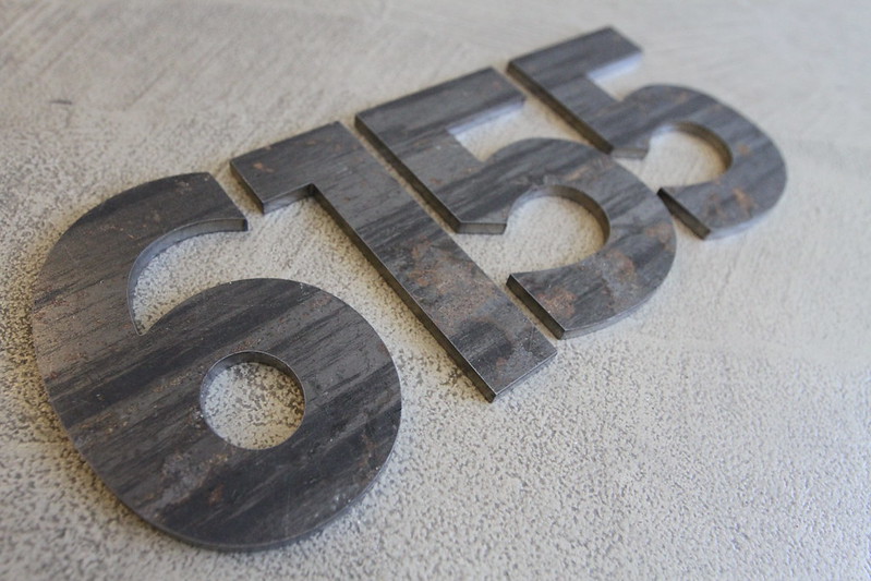 Corten sign letters with a slight patina of rust